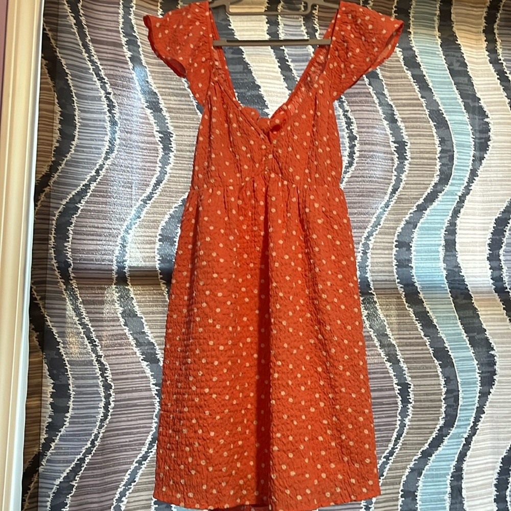 Pink and white polkadotted tied back ruffle sleeve American Eagle size large